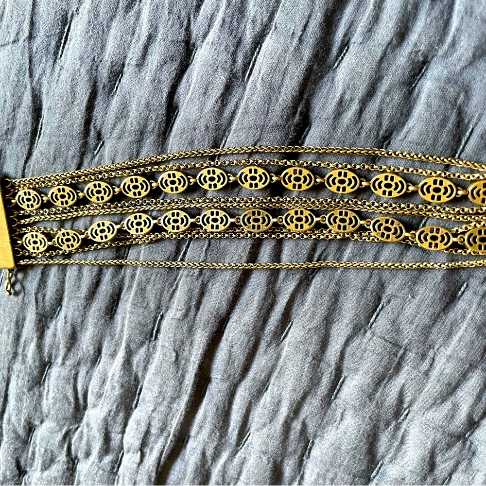 Multi layered gold tone metal bracelet by Lucky